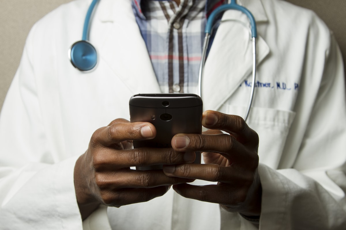 Doctor reviewing patient data on a medical tablet