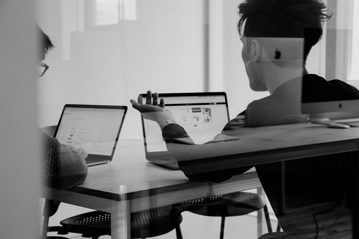 Consultants mapping business processes on a whiteboard